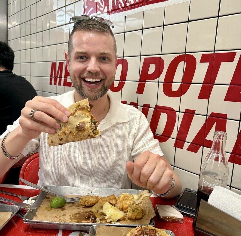 Ty Neely eating a taco in Mexico City