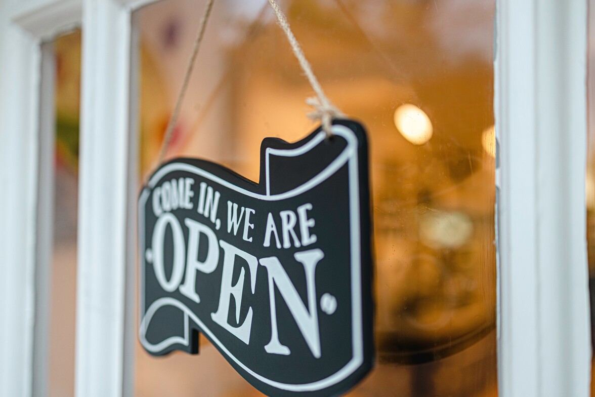 sign saying come on in we're open